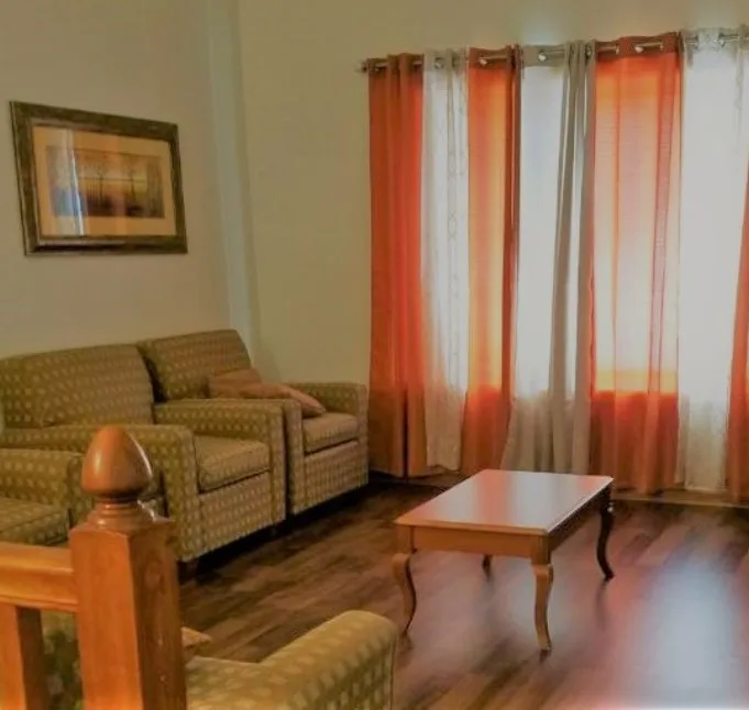 Comfortable shared living room inside a GreaterCare home